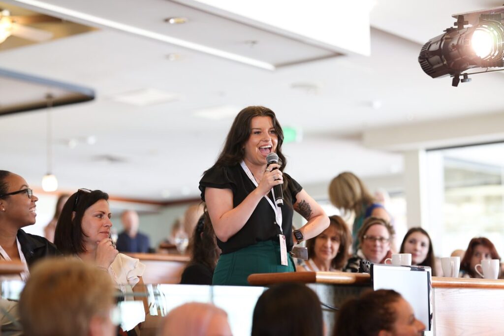 Woman speaking at horse racing event